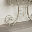 Distressed White Metal Side Table With Curled Legs