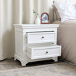 This Large White 7 Drawer Chest of Drawers &amp; Pair of Wide Bedside Tables from the Daventry White Range is a classic, stylish furniture set, ideal for those with neutral interiors. Made of wood and metal, this set includes a large 7 drawer chest of drawers