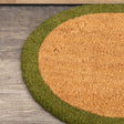 Natural Oval Coir Door Mat with a Green Border