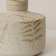 Small Round Cream Speckled Ceramic Vase With An Embossed Fern Leaf Pattern - 12.5cm x 9.5cm