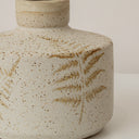 Small Round Cream Speckled Ceramic Vase With An Embossed Fern Leaf Pattern - 12.5cm x 9.5cm