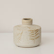 Small Round Cream Speckled Ceramic Vase With An Embossed Fern Leaf Pattern - 12.5cm x 9.5cm